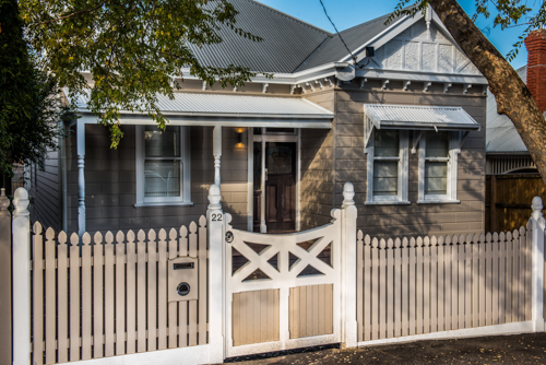 Picket fence with wooden gate